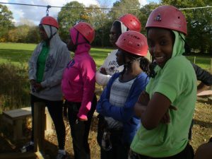 Group of girls preparing to rock climb