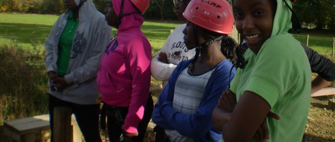 Group of girls preparing to rock climb